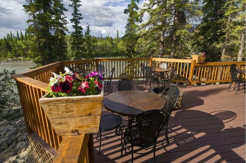 Enjoy a drink on the patio and watch the rafts float by.