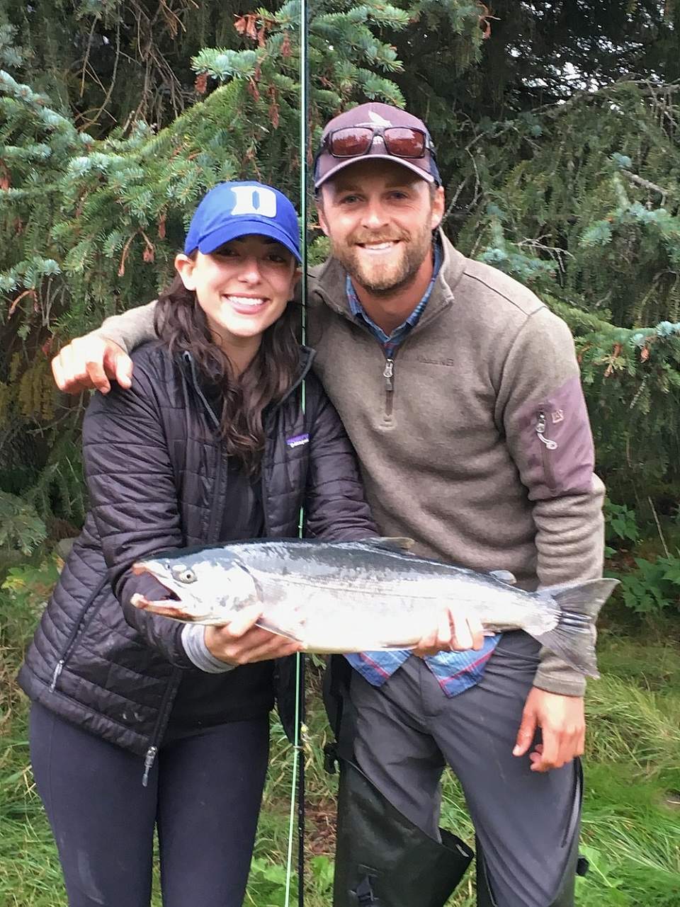 Eric and girlfriend hold a salmon