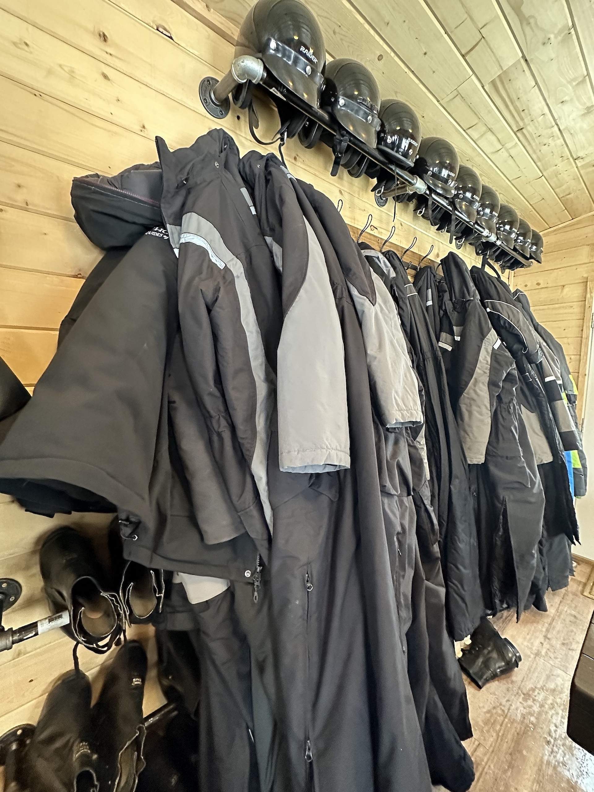 A line of snowgear hangs on the wall at Snowhook Adventure Guides of Alaska.