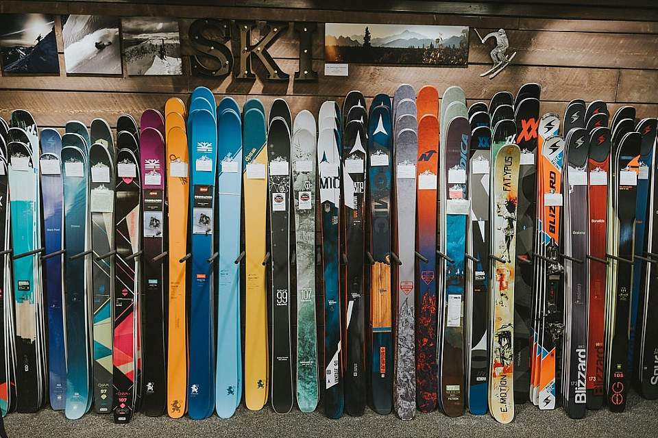 Skis stacked in a row at The Powder Hound Ski Shop