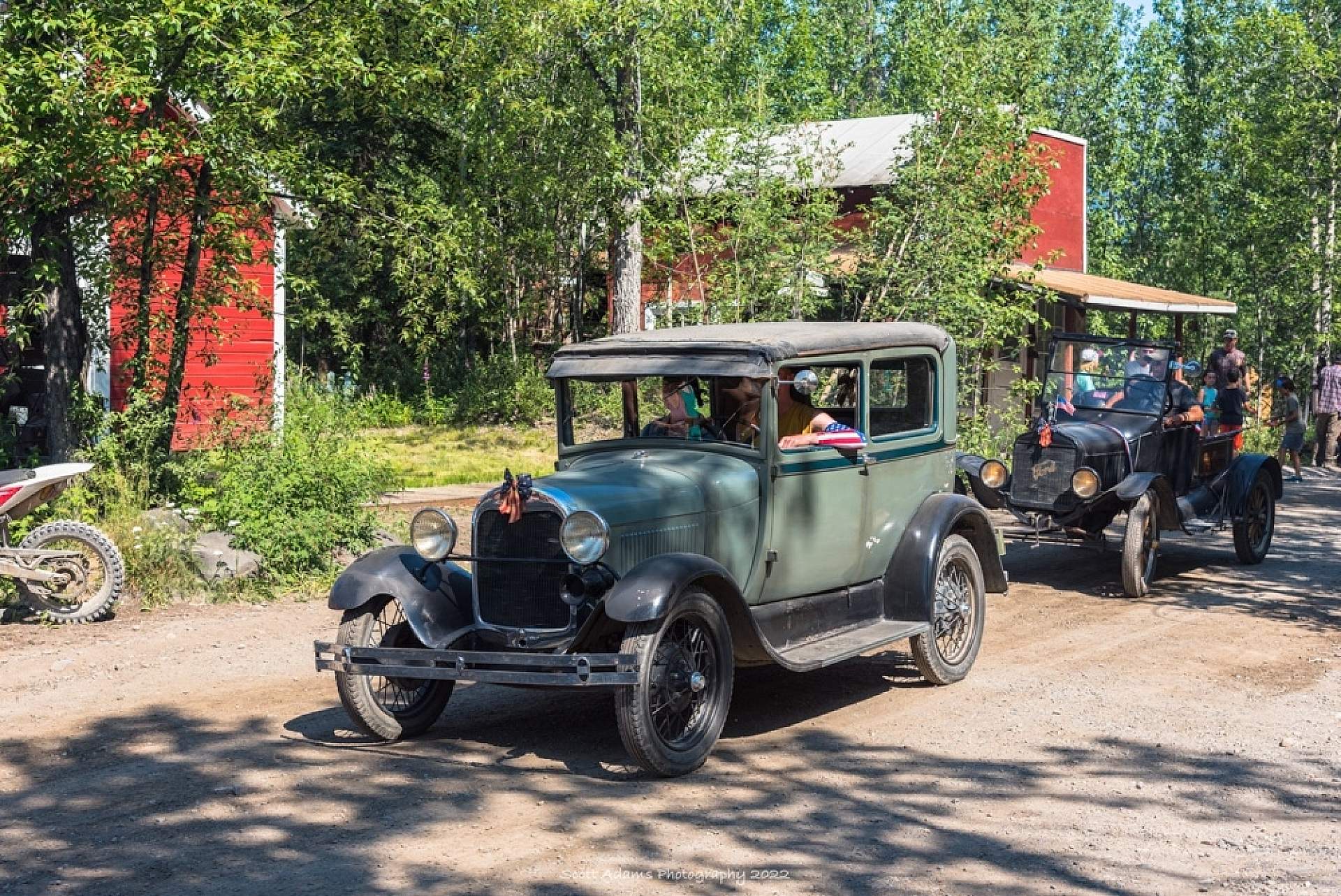 Antique vehicles in a parade