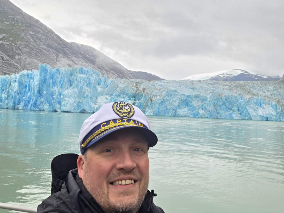 Calving-stunned and grinning—spray on my jacket, glacier at my shoulder.