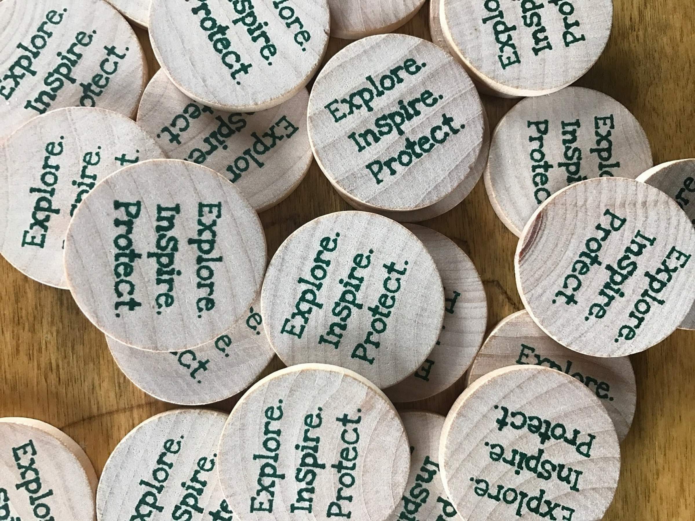 Wood tokens to donate to an environmental cause