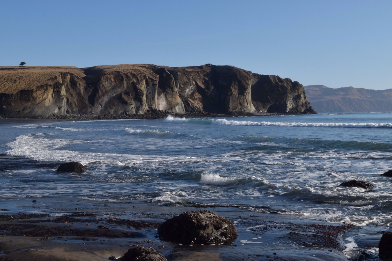 A cliff's edge and beach in Kodiak