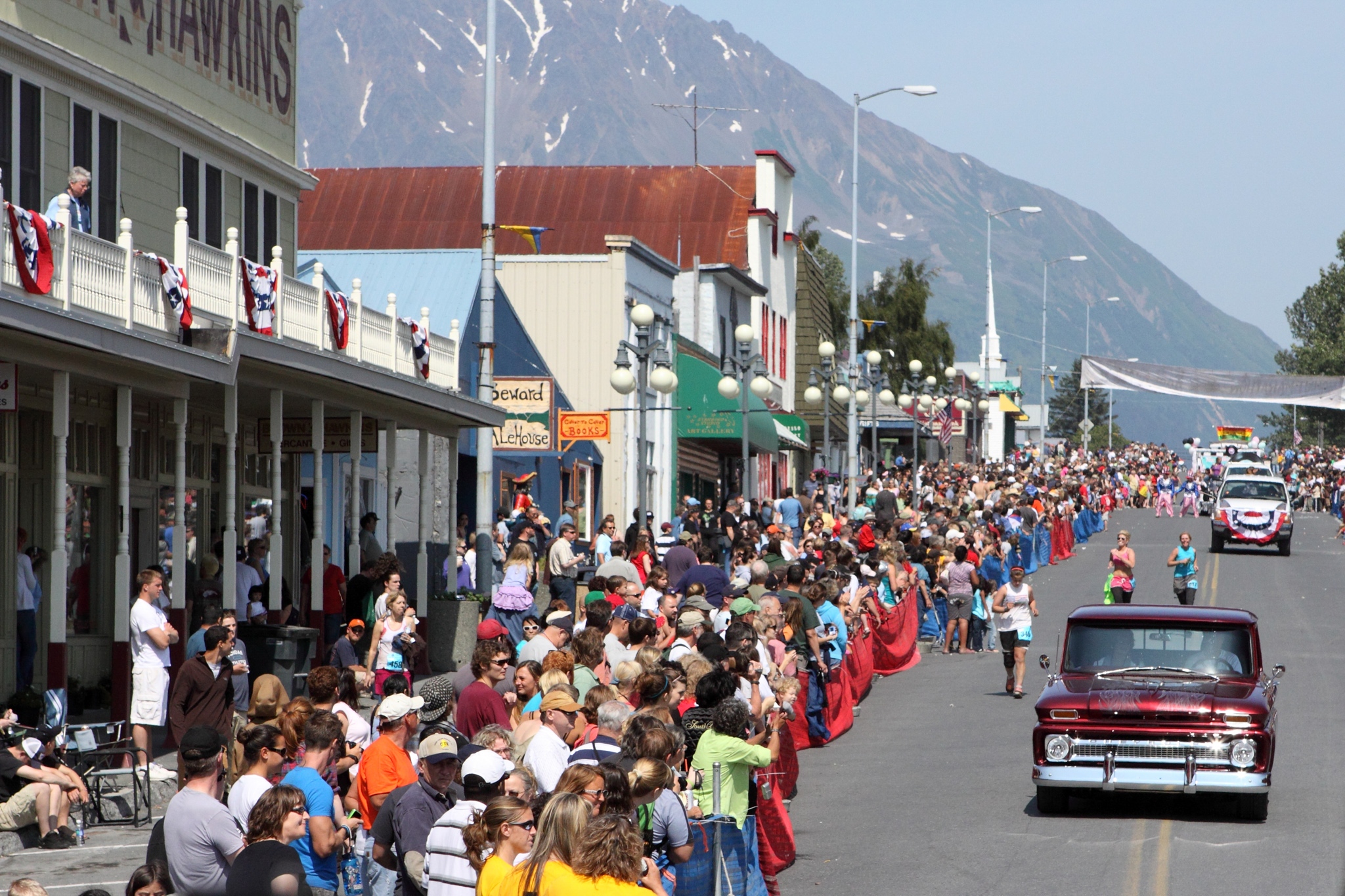 People lining the street for a 4th of July parade in Seward