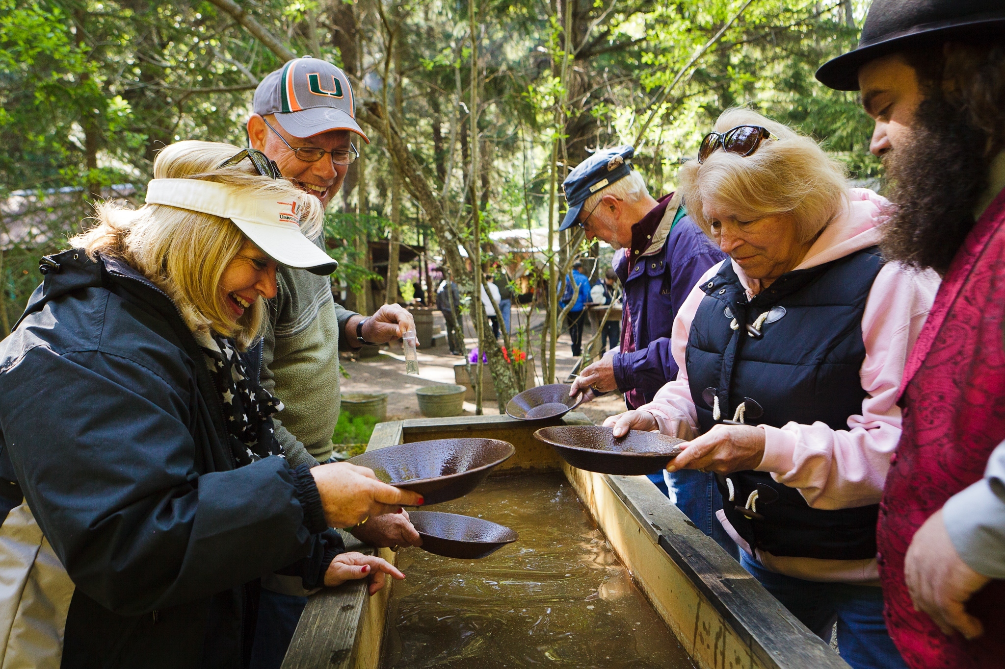 A group of people gold panning