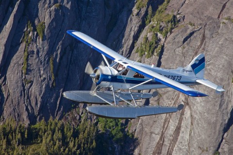 Fly over gorgeous fjords, narrow inlets and steep-sided cliffs