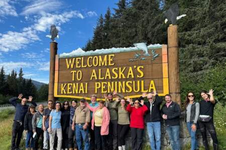 Gondwana Ecotours Glaciers Grizzlies D1 Guests With Kenai Peninsula Sign Kirsten Marquez