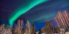 Gondwana Ecotours Northern Lights D8 Guest posing with Aurora Kirsten Marquez