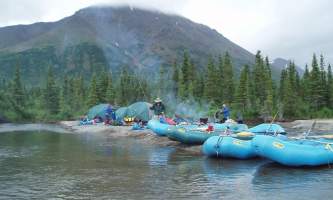 Aniak-air-guides-Rafting-Many_Rafts_on_River-pmesu9