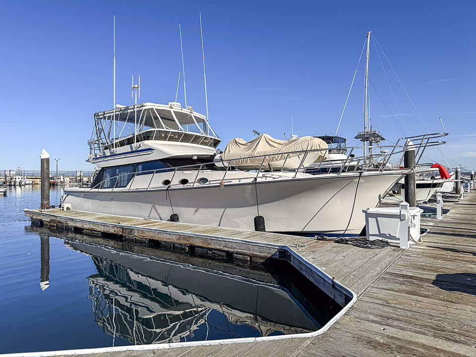 Sail the Alaskan waters in luxury aboard the custom-made, 50-foot Mikelson Sportfish yacht 'Sir Reel,' complete with a massive fishing deck and enclosed fly bridge, ready to cater to every angler's dream.