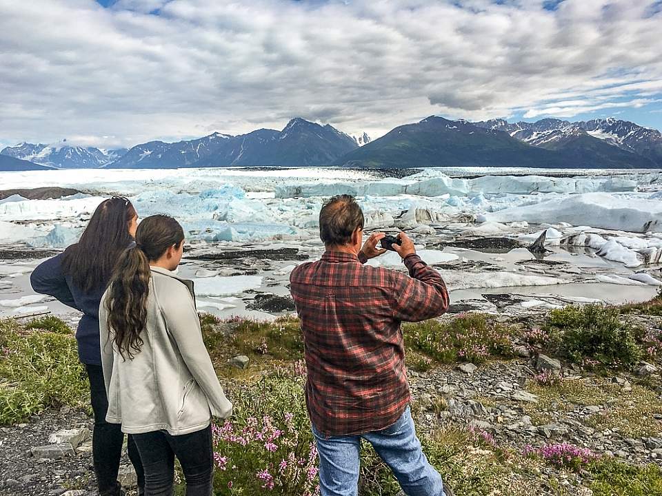 Family takes photo of a glacier