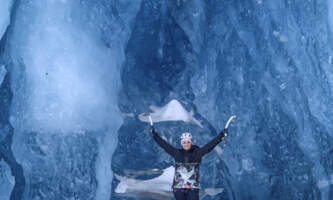 Alaska Helicopter Tours Ice Cave with woman ice climber Dawn Campbell