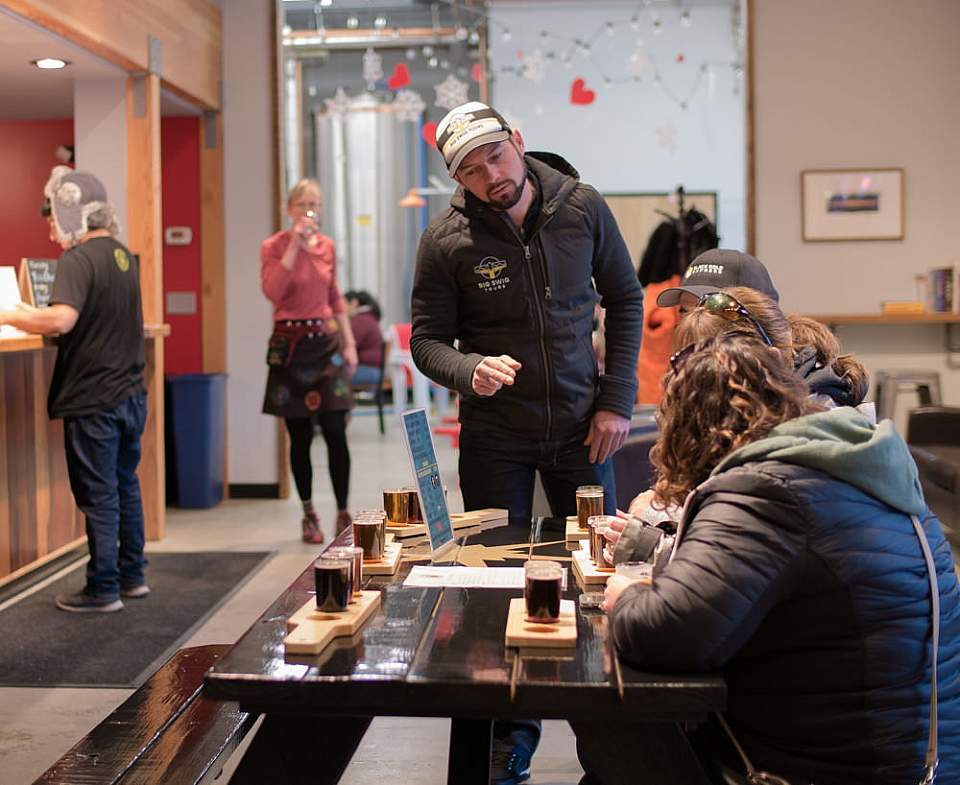 Big Swig owner Bryan with guests at an Anchorage brewery