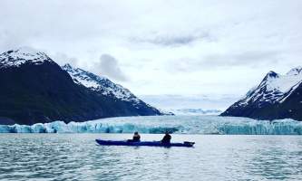 Glacier blue kayak Kayak with Spencer Glacier Face Background2019