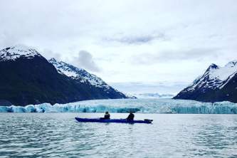Glacier blue kayak Kayak with Spencer Glacier Face Background2019