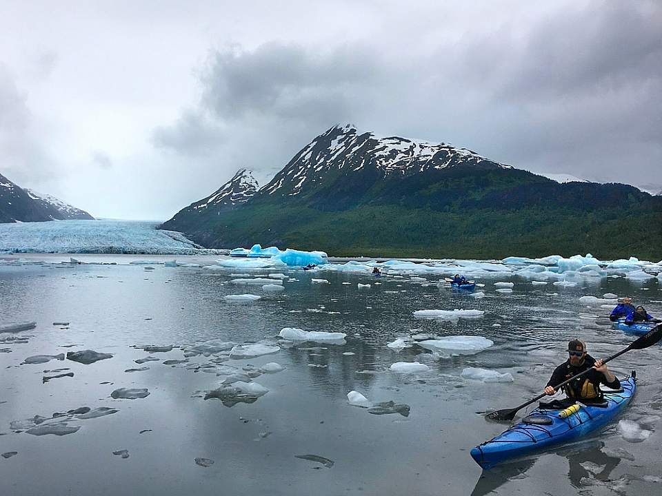Paddler's take a 3-mile roundtrip exploration of Spencer Lake, navigating the icebergs that have calved from the glacier.
