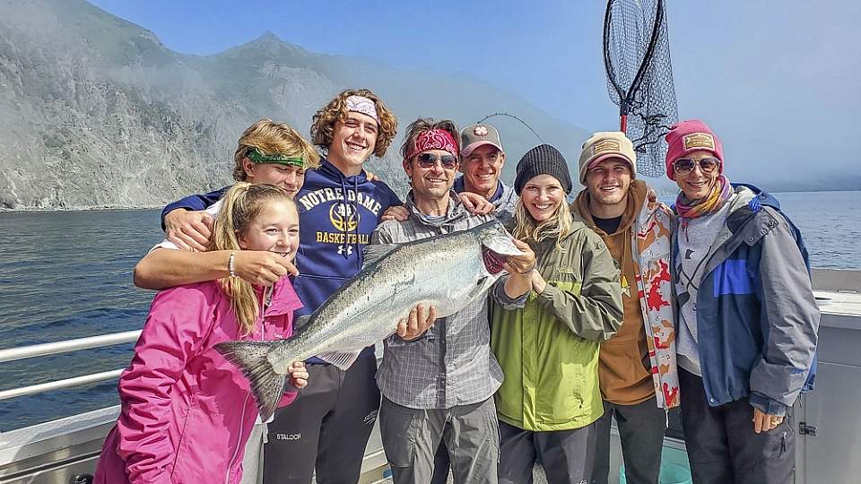 Family poses with their fish