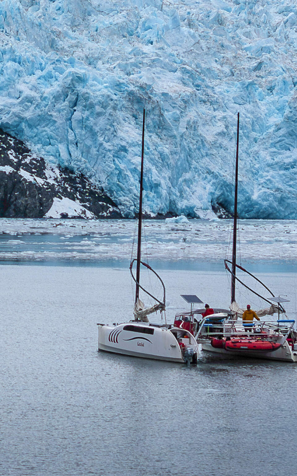 Happy Puffin cruises in front of a tidewater glacier near Seward, Alaska