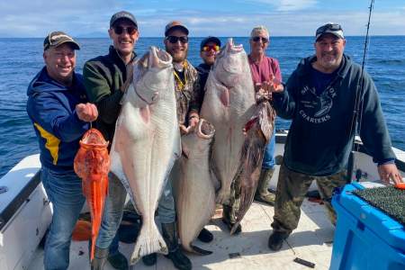 Kayak Fisherman Lands Big Ol' Halibut Off The Coast Of Alaska