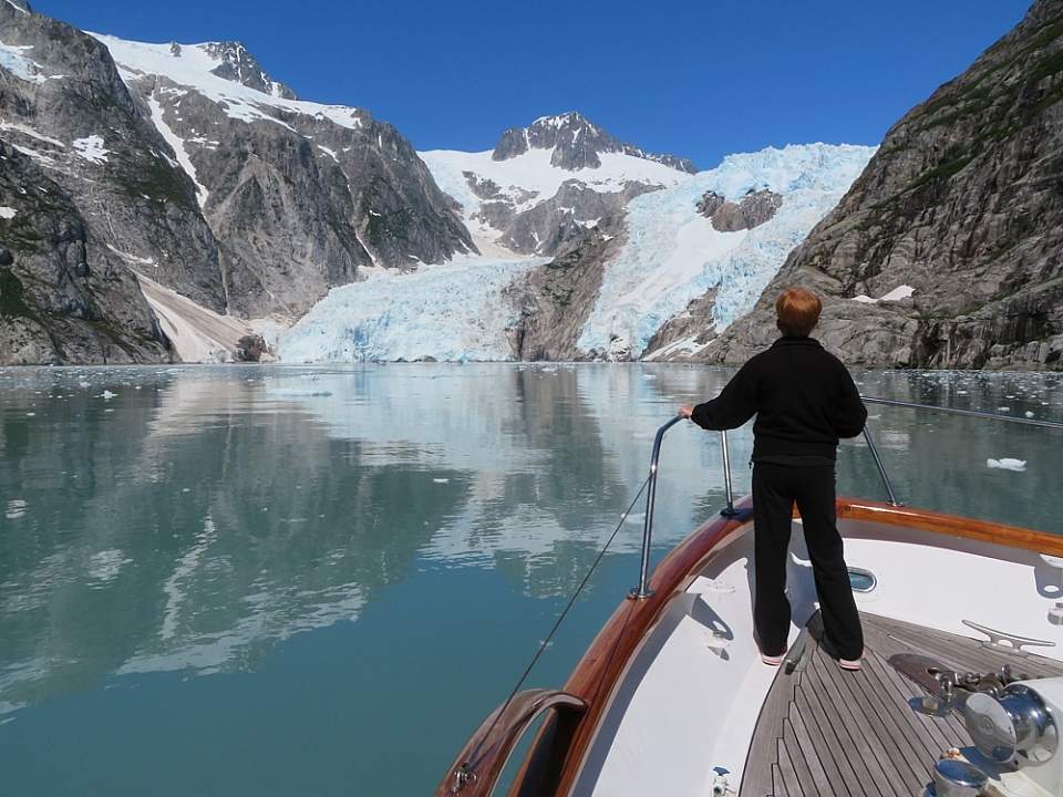 Look out from a boat at a glacier.