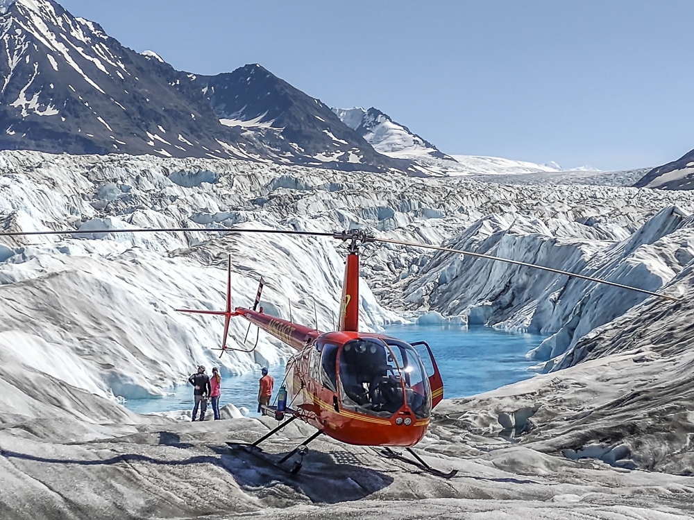 Take a spec­tac­u­lar heli­copter ride through Alaska’s dra­mat­ic scenery