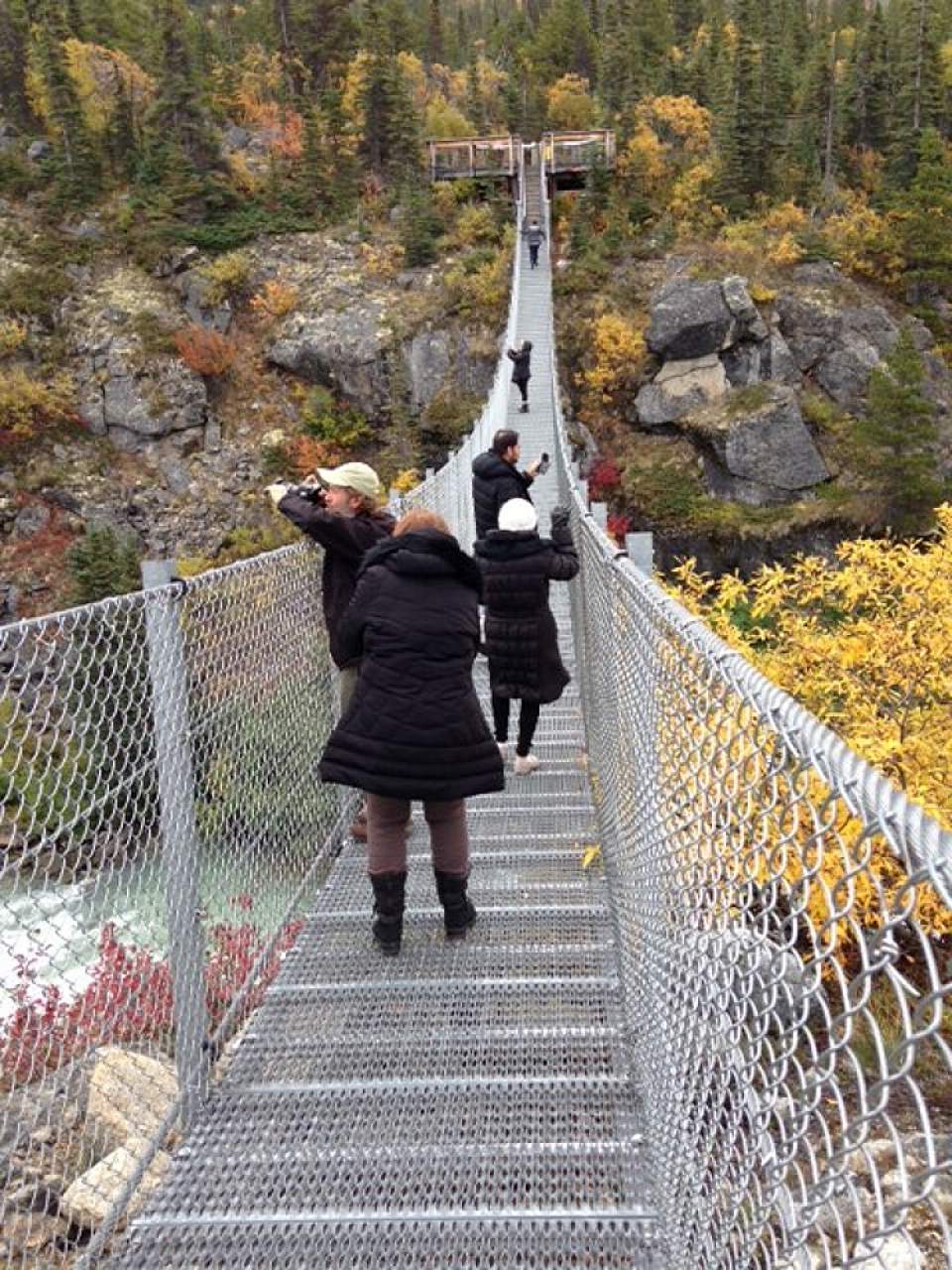 Guests take in the sights from the Yukon Suspension Bridge