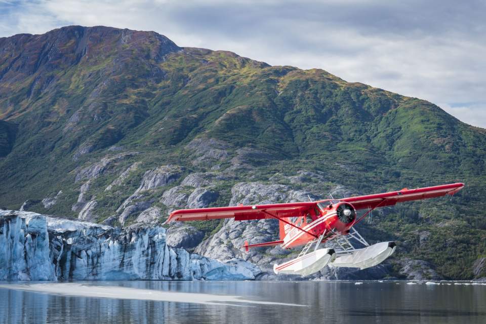 Floatplane landing in front of glacier in Prince William Sound