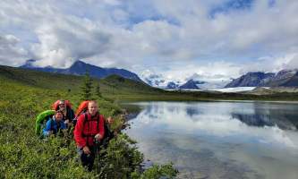 St elias alpine guides Hiking by Alaskan Alpine Lake