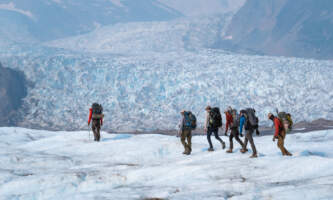 Backpacking beside an icefall