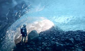 Person looking toward the exit of a bright blue ice cave Anya Voskresensky