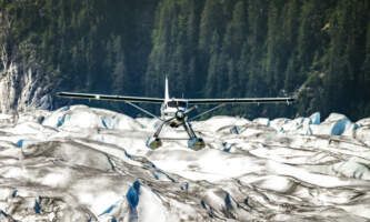 Taku Glacier Ldg Wings Airways CM Three Planes Taku Lodge View from River Holly