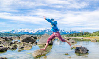 Girl rock jumping Picture Pointhaines visitor centeralaska org haines visitor center alaska org