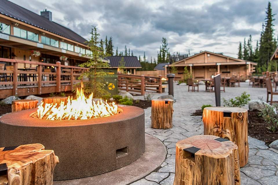 An outdoor fire pit in a rustic courtyard.