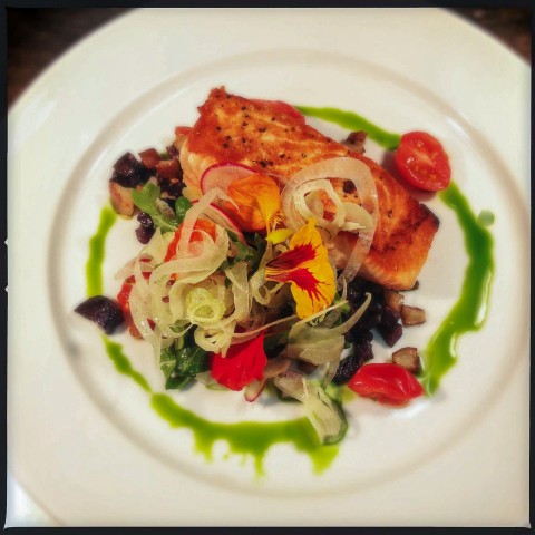 An elegantly arranged dish of fish.