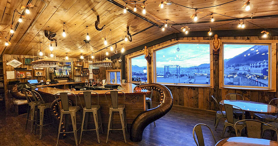 The upstairs Kraken Lounge features a wooden boat-shaped bar that is being “pulled to the depths” by huge kraken tentacles