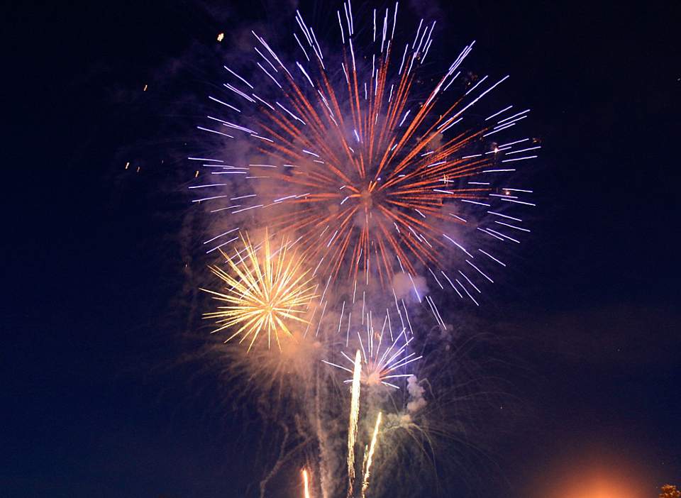 Anchorage's free New Year's Eve celebration features fireworks over Cook Inlet, live music, food trucks, fire dancers, and a sledding hill