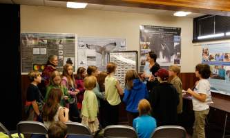 Sitka whalefest alaska The Science Exhibit Room at Whale Fest where a scientist is giving a talk to grade school children Tim Shobe whale fest