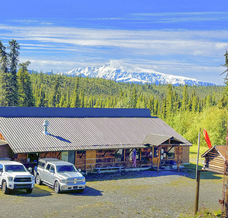 view of avens alaska lodge with wrangell st. elias mountains in the distance