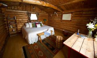 Cabin 1 King bed Mara Bartlett Asenjo alaska untitled