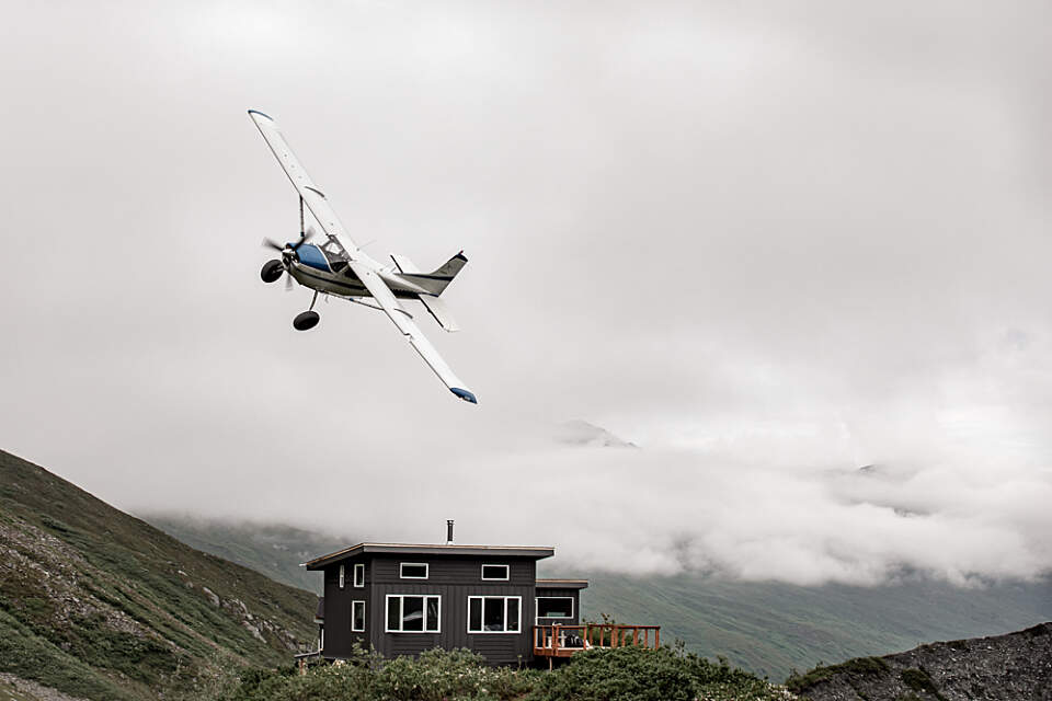 A fly-in-only modern cabin perched above the Matanuska Glacier.