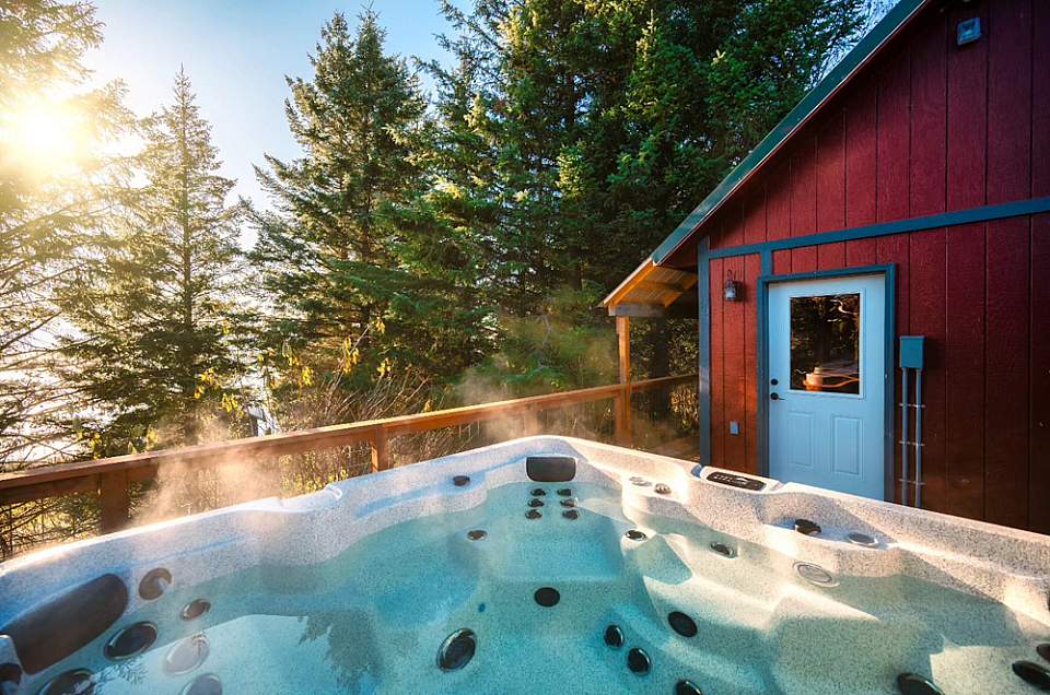 Each cabin features a private hot tub and outdoor seating area—perfect for relaxing while taking in Alaska’s coastal scenery.
