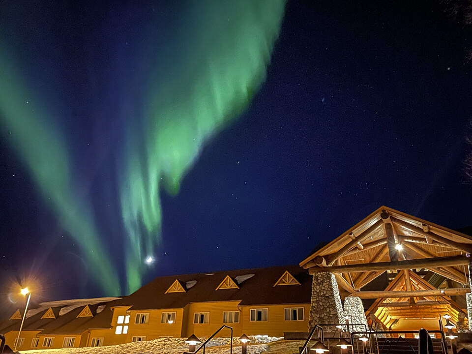Cozy up at Talkeetna Alaskan Lodge for a winter escape filled with northern lights, snowshoeing, and live music