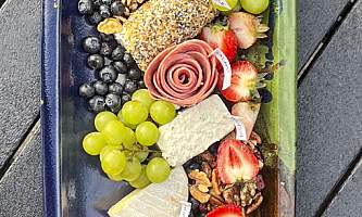 The lodge at whale pass Charcuterie in boat vertical Lucas Ryter