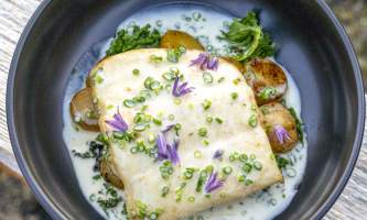 The lodge at whale pass Halibut with purple flowers from above cropped Lucas Ryter