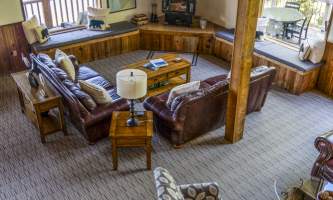 The lodge at whale pass Main Lodge fireplace from above vertical Lucas Ryter