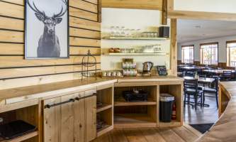 The lodge at whale pass Main Lodge tea time with deer horizontal Lucas Ryter