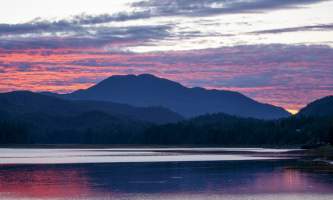 The lodge at whale pass Orange sunset wide with maggie Lucas Ryter