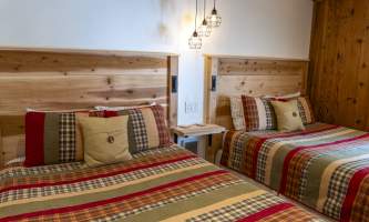 The lodge at whale pass Room 9 beds closeup from closet horizontal Lucas Ryter