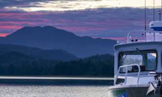 The lodge at whale pass Sunset with boat and maggie Lucas Ryter